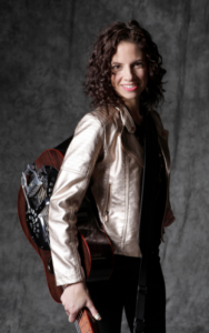 Abbie Gardner holding Beard Guitar