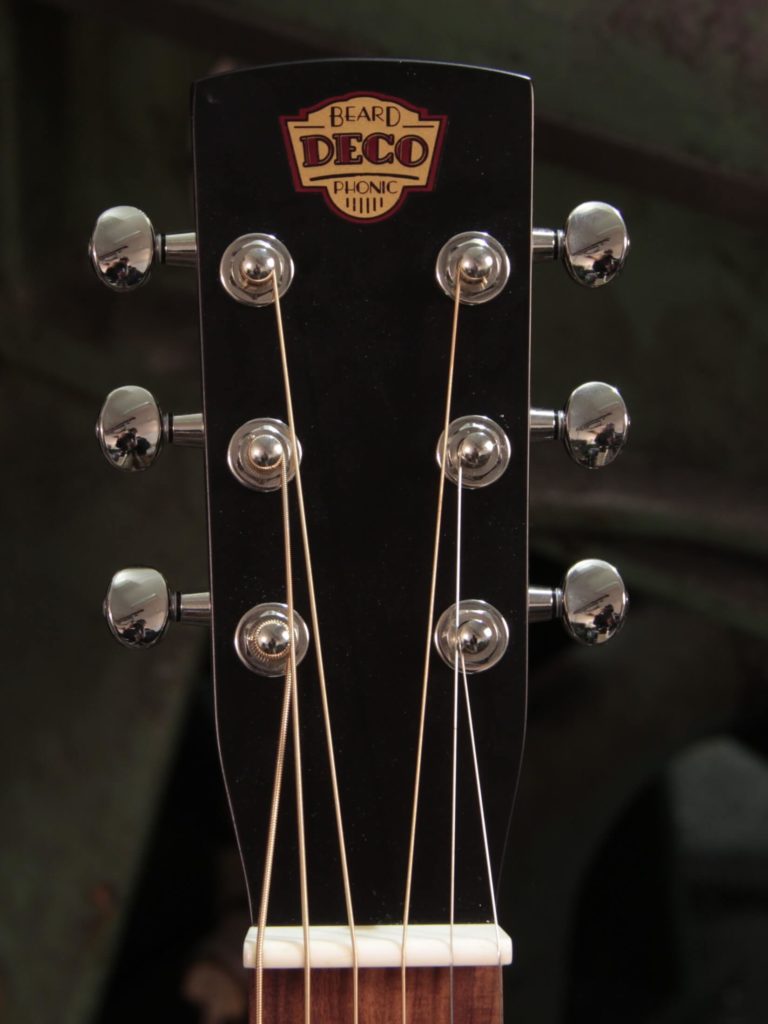 Deco Phonic-57 resonator guitar close up on peghead