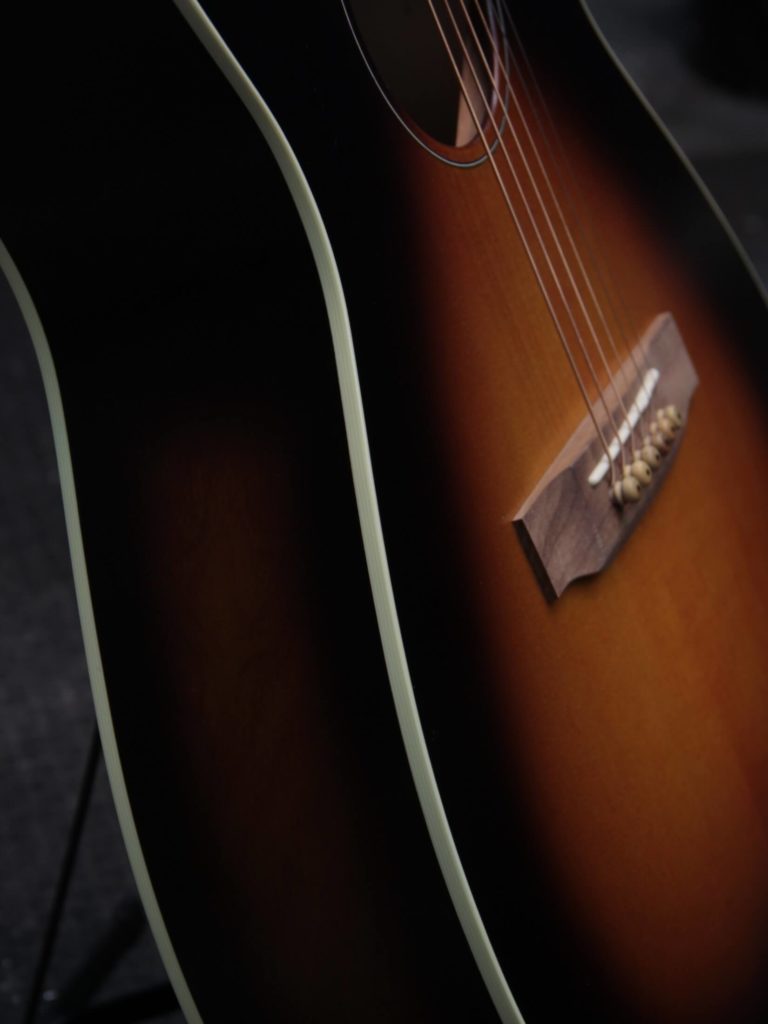 Deco Phonic Sidecar acoustic guitar close up on binding