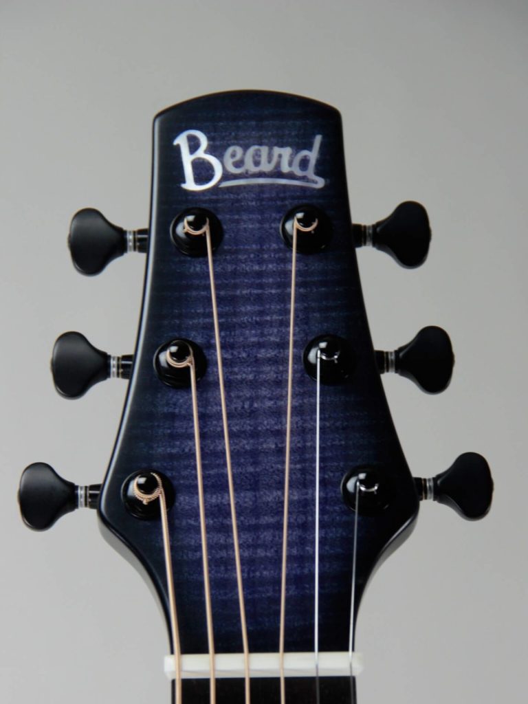 Josh Swift Signature resonator guitar close up on peghead, Purple Reign sunburst