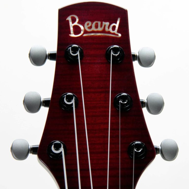 Josh Swift Signature resonator guitar close up on peghead, Red Assault sunburst