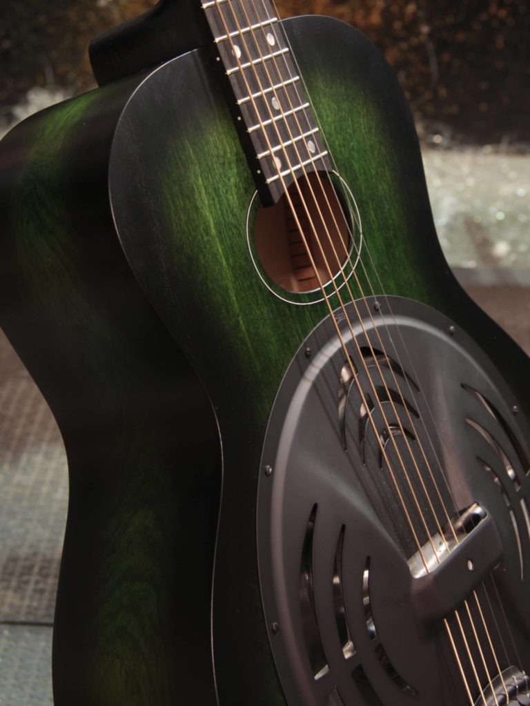Radio Standard-A resonator guitar close up on soundhole, Emerald green