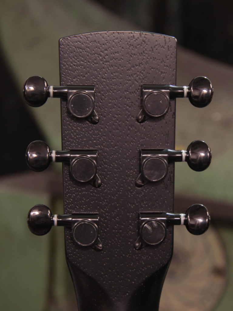 Radio Standard-A resonator guitar close up on peghead, Emerald green