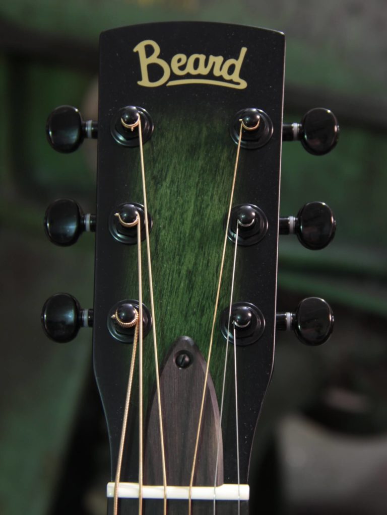 Radio Standard-A resonator guitar close up on peghead, Emerald green