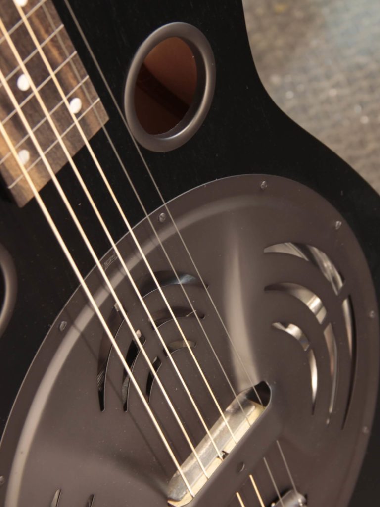 Radio Standard-E resonator guitar close up on coverplate, Black Ice