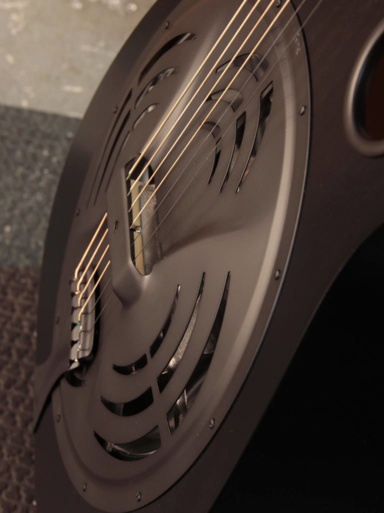 Radio Standard-E resonator guitar close up on coverplate, Black Ice