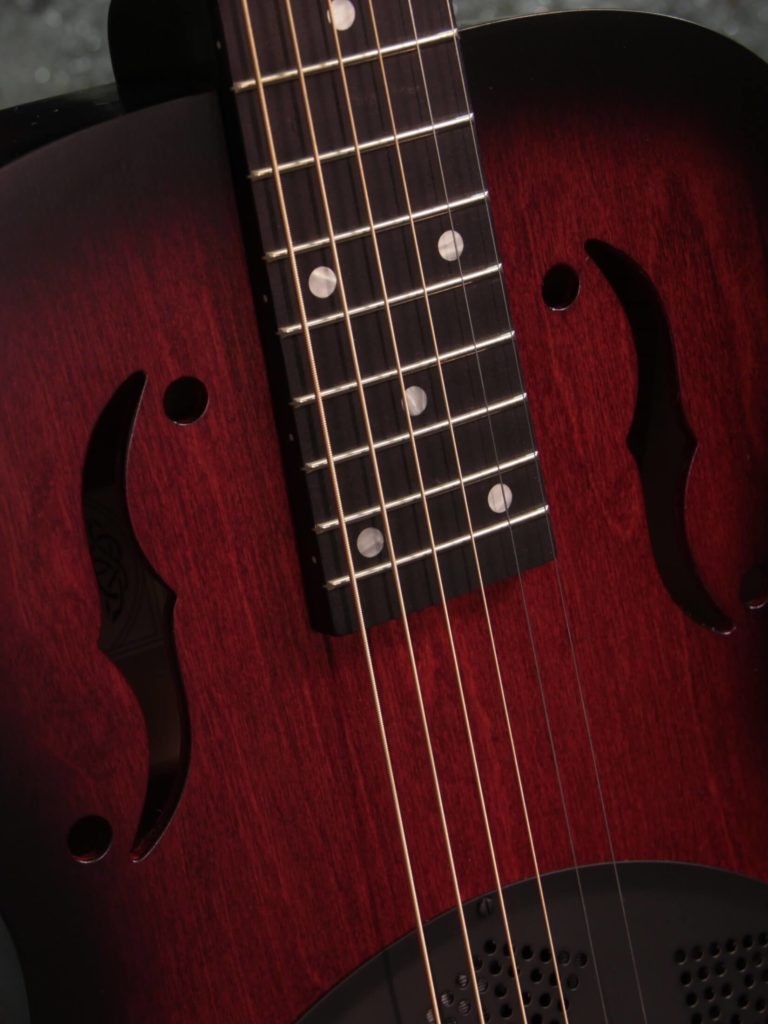 Radio Standard-RFB resonator guitar close up on f-holes, Scarlet sunburst