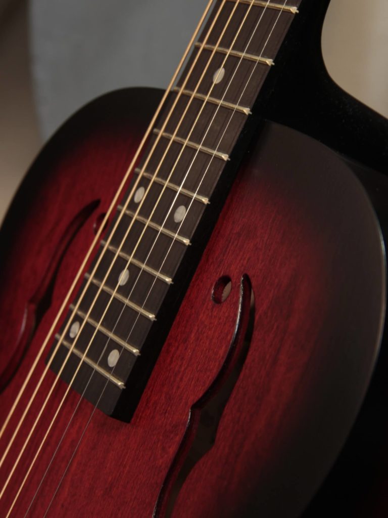 Radio Standard-RFB resonator guitar close up on fretboard, Scarlet sunburst