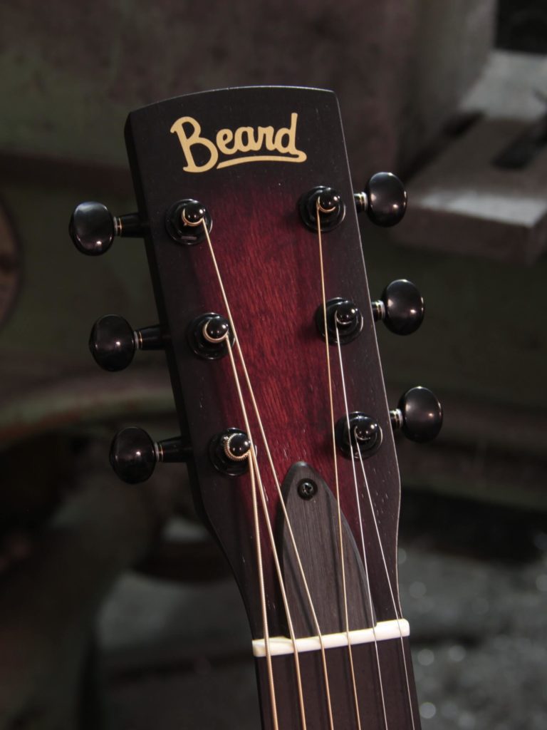 Radio Standard-RFB resonator guitar close up on peghead, Scarlet sunburst